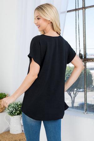 Short sleeve V neck dolman woven top in black color