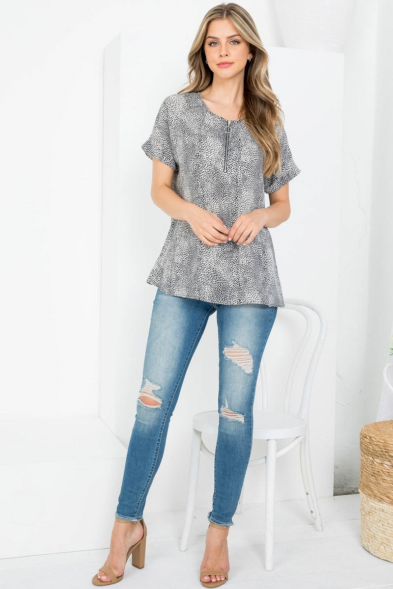 Short sleeve animal print zipper front dolman blouse top