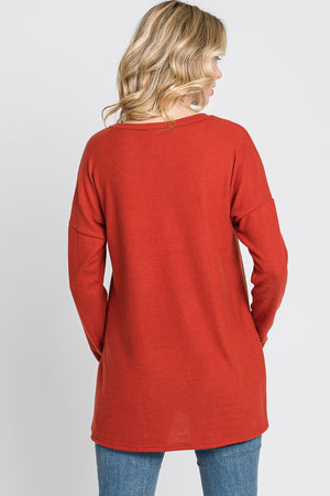 Long sleeve pocket hi low knit rust top